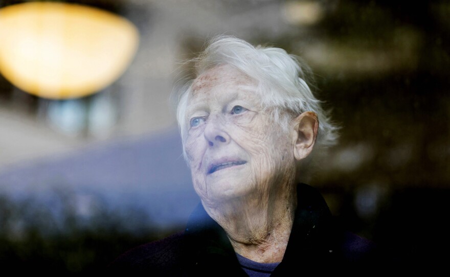 Margaret Sullivan looks out the windows of Goodwin House in Falls Church, Va.