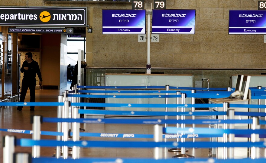 Israel has announced a blanket quarantine policy for anyone entering the country; the policy will be in effect for two weeks. Here, empty airline check-in counters are seen at Ben Gurion Airport, near Tel Aviv.