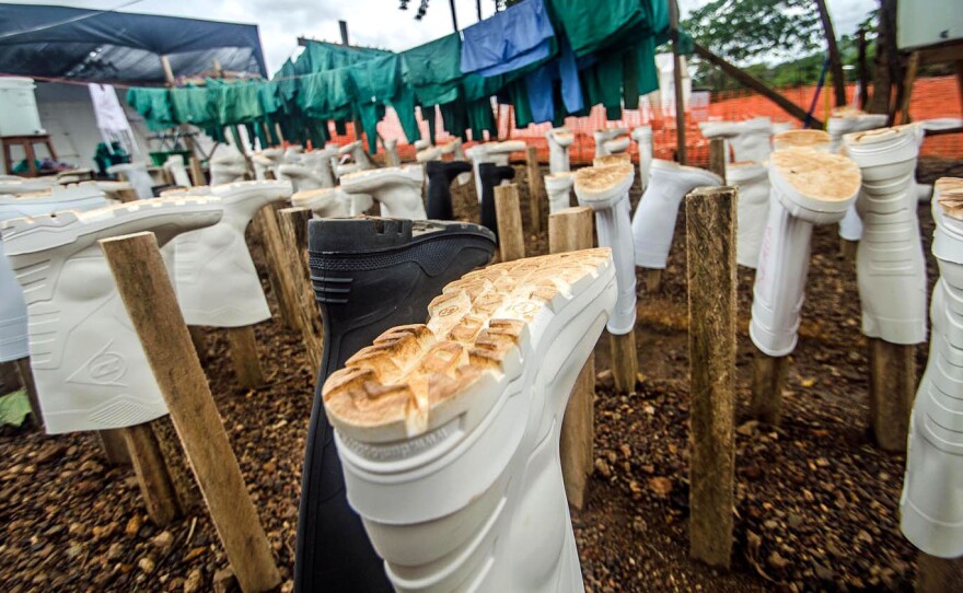Wellington boots, part of a health care worker's protective gear, hang out to dry at the Doctors Without Borders treatment center in Kailahun, Sierra Leone. Dr. Khan is now in the center's isolation ward.