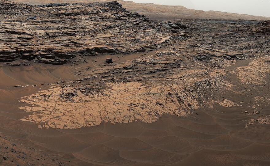 NASA's Curiosity Mars rover captured this composite view of the "Marias Pass" area, showing layers of mudstone and sandstone. The rover found high levels of silica, as well as a rare mineral it had never seen on Mars: tridymite.