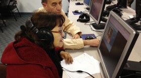 Donald Desmond teaches Abdesa Bustina to use a computer at the New Haven Adult and Continuing Education Center. The new GED will be offered only on computer, but many students here don't know how to use one.