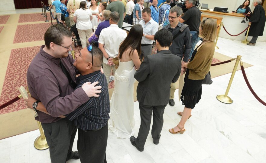Lining up to be married: Adam Chandler, 33, left, and Ivan Chandler, 38, both of Citrus Heights, were among those waiting in line Saturday to get married at San Francisco City Hall.