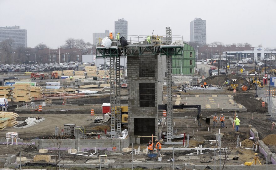 Construction continues on Orleans Landing, a housing development along the Detroit riverfront. A year after its exit from bankruptcy, new development is booming downtown.