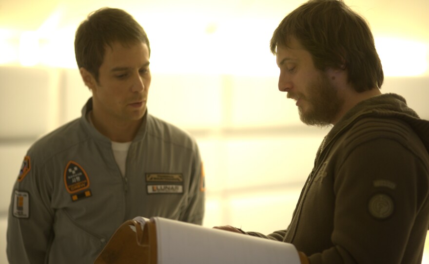 Actor Sam Rockwell with director Duncan Jones on the set of "Moon"