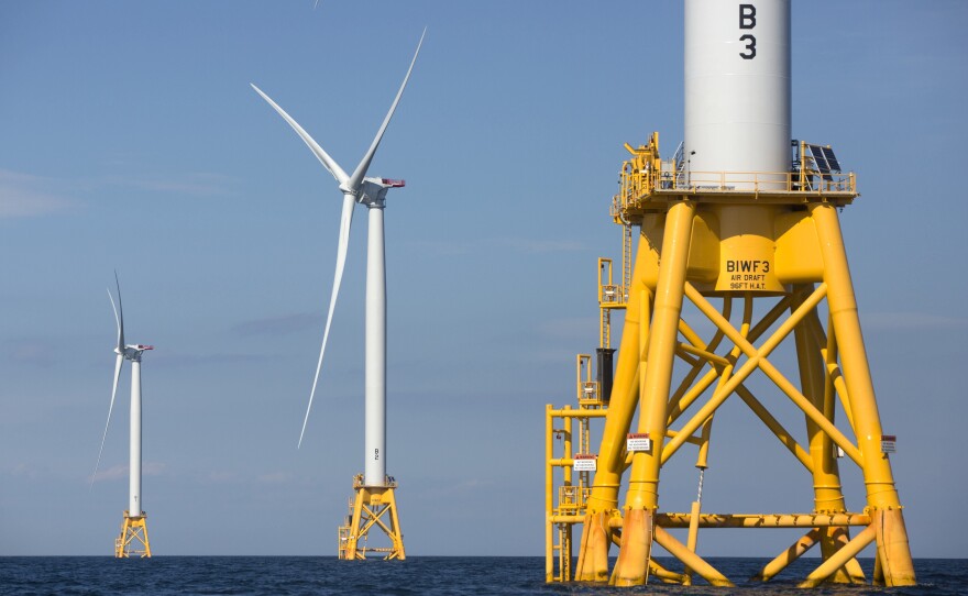 Three of Deepwater Wind's turbines stand off Block Island, R.I. The Biden administration is pushing for a sharp increase in offshore wind energy development along the East Coast.