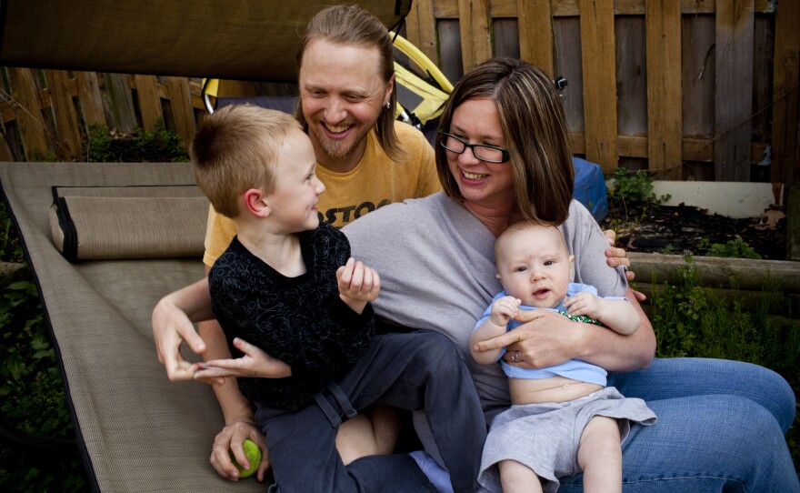 Jonathan and Dawn Heisey-Grove with their two sons Egan, 5, and Zane, 4 months, at their home in Alexandria, Va.