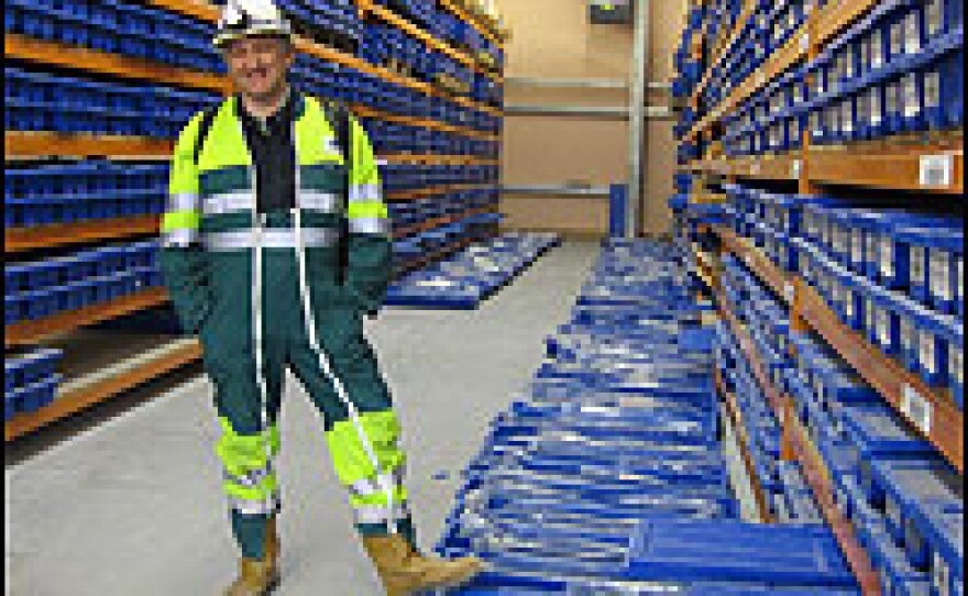 Eric Sutre is a geologist with ANDRA, the government agency that is studying the waste site. The blue boxes contain cylinders of rock drilled out of the earth.