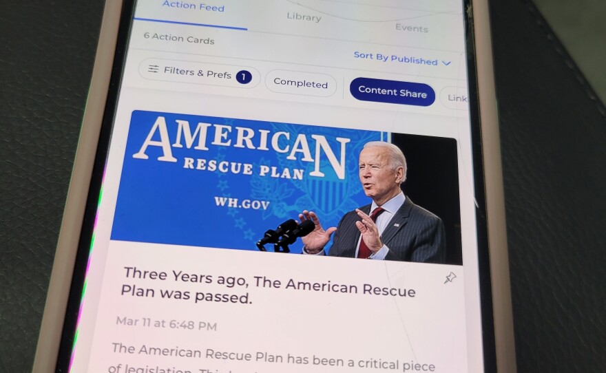 The Reach app, as seen on volunteer Sarah Harrison's phone, allows Biden supporters to share content directly with their contacts, and is connected to a national Democratic party voter database.