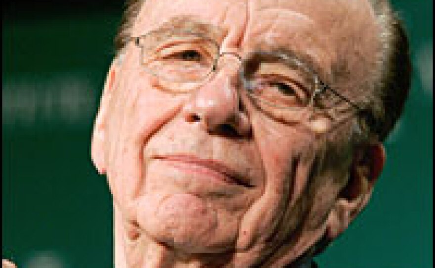 Media tycoon Rupert Murdoch wins enough support from Dow Jones & Co.'s controlling shareholders to ensure acceptance of his bid for the company.