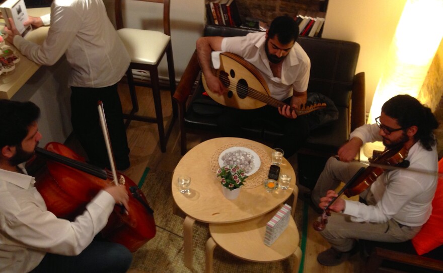 A trio of Syrian musicians perform at the opening of Pages bookstore in Istanbul. The store has a cafe and a play area for children, and owners hope to host movie screenings and workshops.