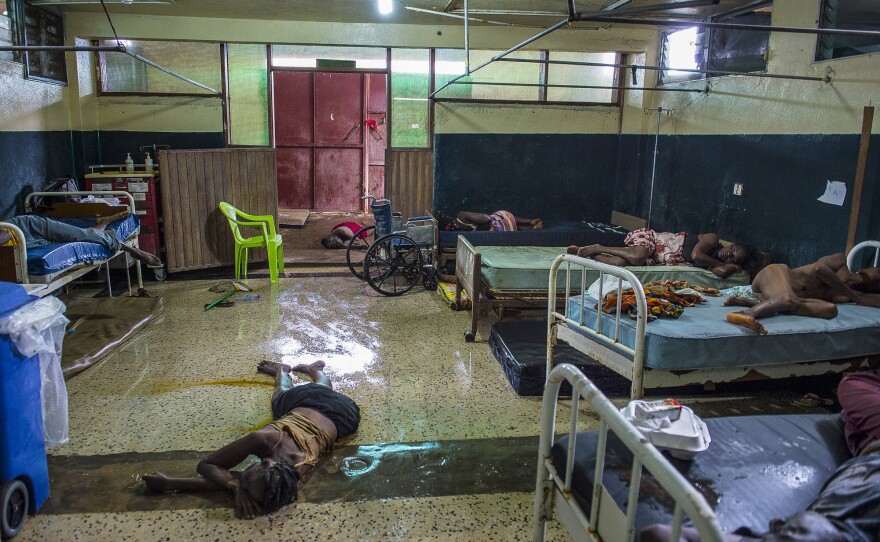 Two people lie dead on the floor inside the critical ward of the Redemption Hospital, which served as a transfer and holding center for Ebola patients.