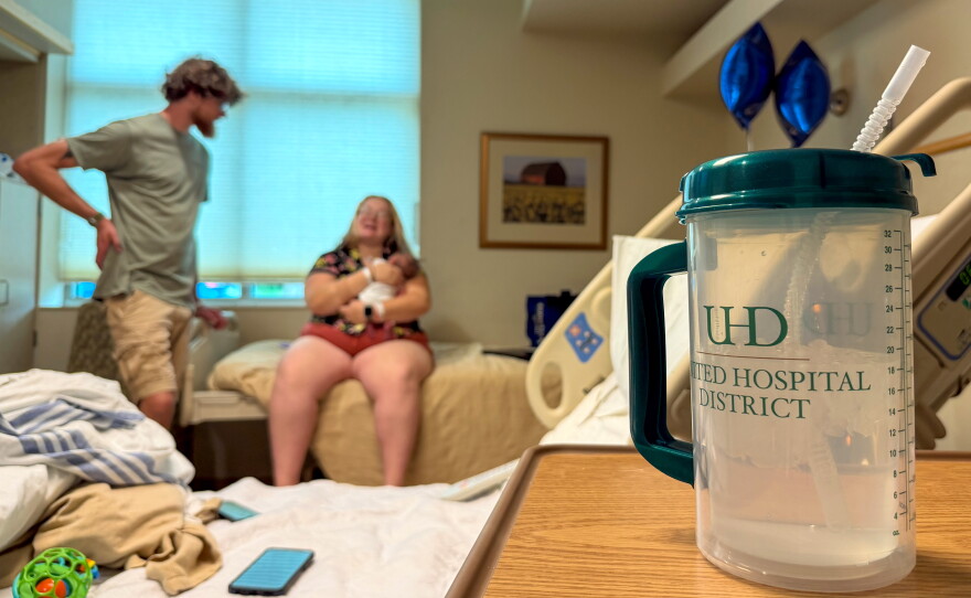 Maija Whitefeather-Manning, 28, and her husband Nick, 29, enjoy moments with their newborn baby in the hospital recovery room .