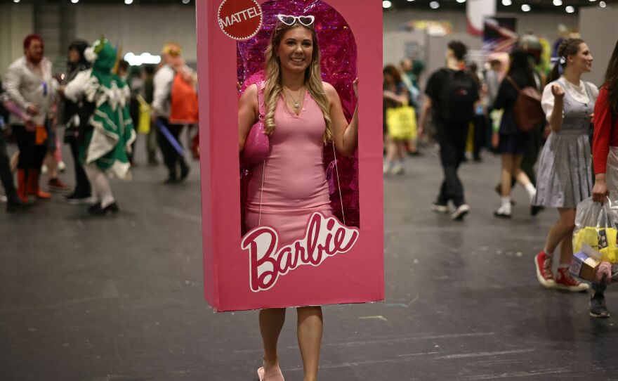 A cosplayer dressed as a boxed Barbie doll attends the MCM Comic Con at ExCeL exhibition centre in London on May 26, 2023.
