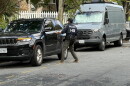 A Homeland Security Investigations agent gets in a car outside the Washington, D.C. residence of Rep. Ilhan Omar, D-Minn., on Monday morning.