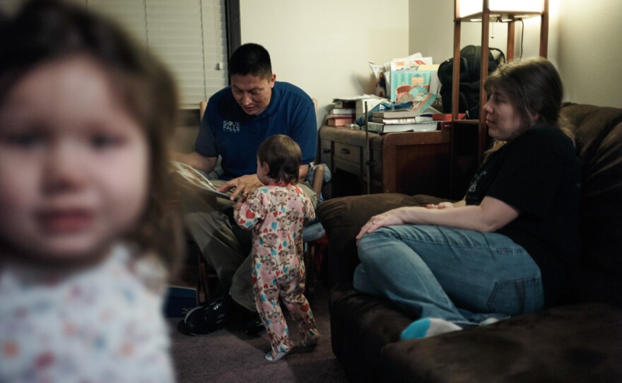 Joe Marrowbone left the reservation and moved to Sioux Falls for a job. He and his wife, Connie, play with daughters Grace and Alicia.