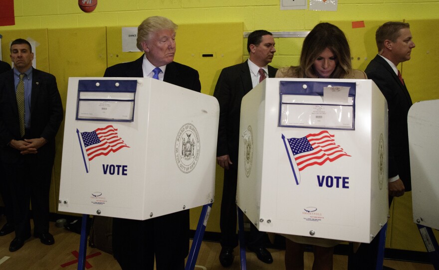 Republican presidential candidate Donald Trump looks at his wife, Melania, as they cast their votes at P.S. 59 in New York on Election Day.