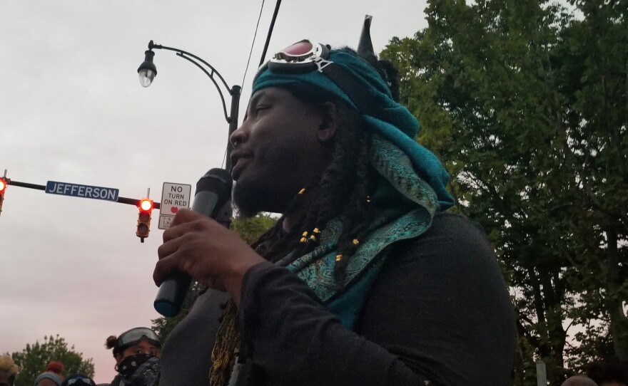 Poet and activist Christopher Coles addresses a crowd in Rochester, N.Y.