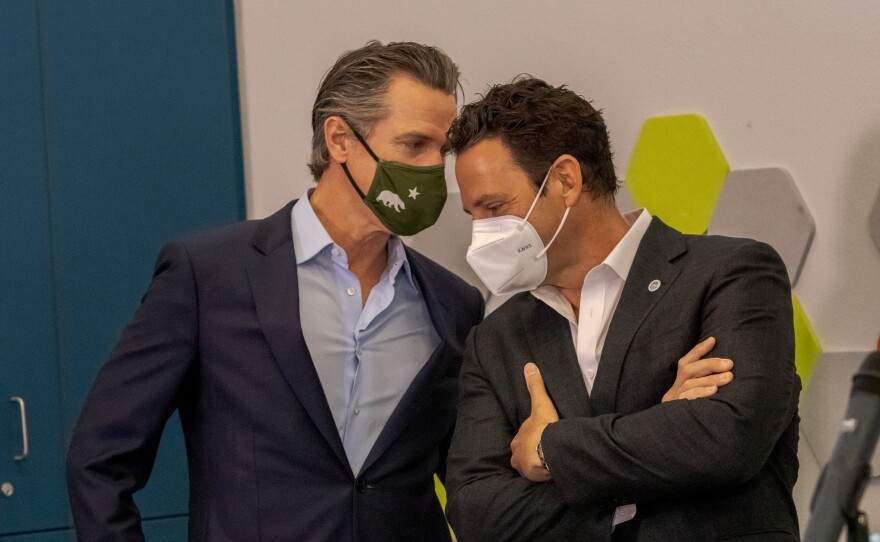 Governor Gavin Newsom and Supervisor Nathan Fletcher talk at a COVID-19 vaccination site, April 2, 2021.