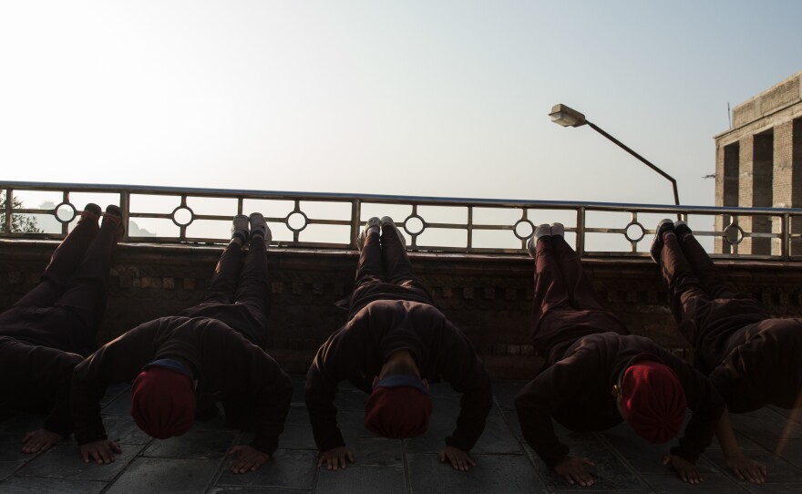 Nuns warm up before their daily kung fu practice.