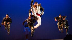 Hip hop dancers from Culture Shock jump high in the air during "A Culture Shock Nutcracker - A Holiday Hip Hop Dance Theatrical." 