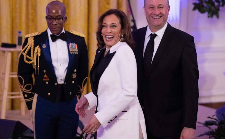 Vice President Kamala Harris (C) and second gentleman Doug Emhoff attend a dinner for governors and their spouses at the White House earlier this month.