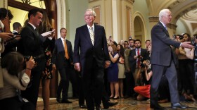 Senate Majority Leader Mitch McConnell of Ky., center, with Senate Majority Whip John Cornyn of Texas, right, and Sen. John Thune, R-S.D., leave the Senate chamber on Capitol Hill in Washington, Tuesday, July 25, 2017. 