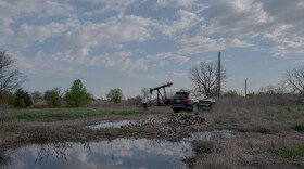 Scott Rabinowitz, president of Grand Resources, stands near a pump jack in Sperry, Okla., on March 20, 2024.