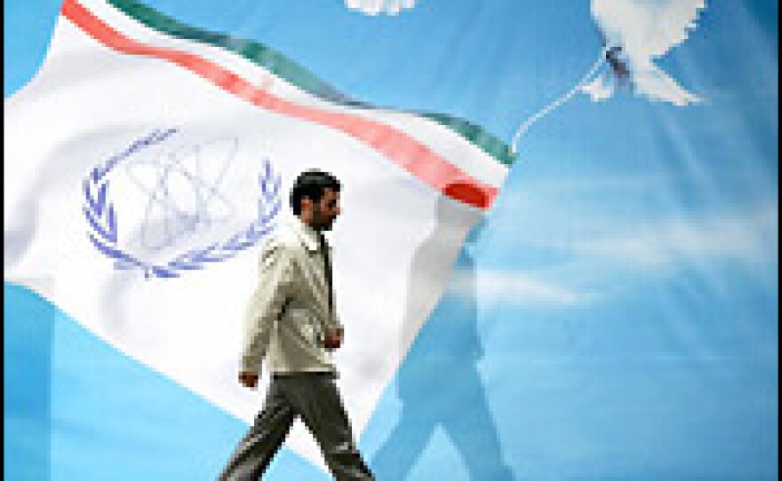 Iranian President Mahmoud Ahmadinejad walks away from the podium after a speech in Mashhad, Iran, on Tuesday in which he said the country would accelerate its nuclear program.