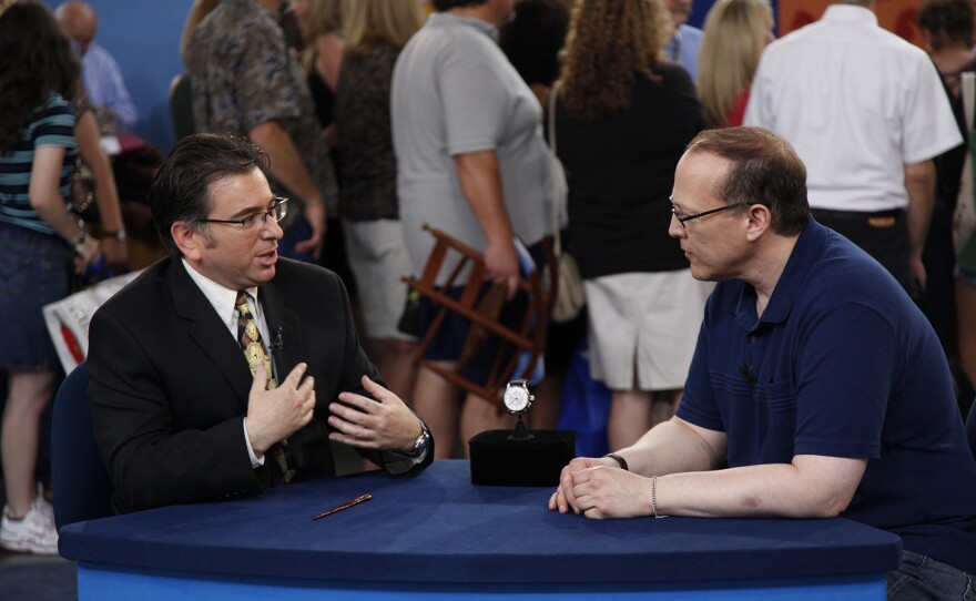 Craig Evan Small (left) appraises a large Longine aviator’s watch, ca. 1938, in San Jose, Calif. ANTIQUES ROADSHOW “Vintage San Jose, Hour 2” airs Monday, September 22 at 8/7C p.m. on PBS. 