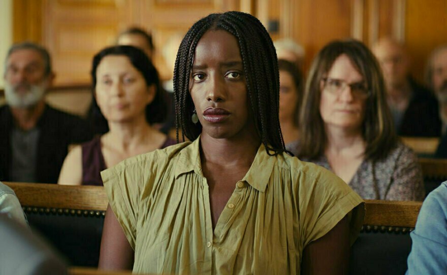 Kayije Kagame plays a writer covering the murder trial.