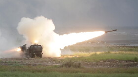 A rocket is launched from a High Mobility Artillery Rocket System (HIMARS) during a military live-fire shooting training in Taichung City, Taiwan, Wednesday, June 10, 2026.