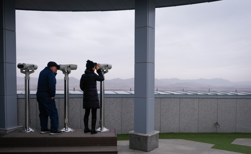 Visitors look into North Korea from the Dorasan observatory.