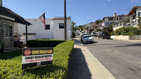A sign in the front yard of a home in Point Loma reads "Stop 1004 Rosecrans — shady developments in our neighborhood," Oct. 16, 2026.