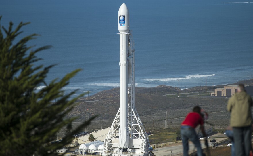 Members of the media setup remote cameras for the SpaceX Falcon 9 rocket launch with the Jason-3 spacecraft onboard at Vandenberg Air Force Base, Calif., on Saturday.