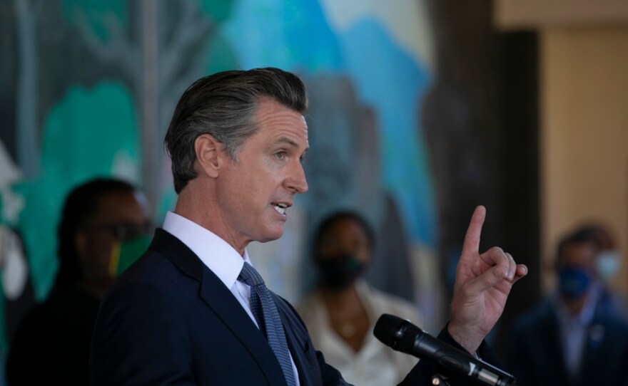Gov. Gavin Newsom announces all school teachers and employees will be required to be vaccinated or undergo weekly COVID-19 testing at a press conference at Carl B. Munck school in Oakland on Aug. 11, 2021.