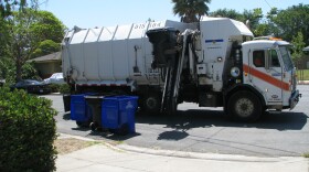 A union operated San Diego garbage truck makes its rounds. City employee unions are balking at a new pension reform the would freeze employee pay in an effort to lower pension costs.
