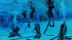 Students from Basic Underwater Demolition/SEAL (BUD/s) Class 287 participate in night gear exchange during the second phase of training at Naval Amphibious Base Coronado.