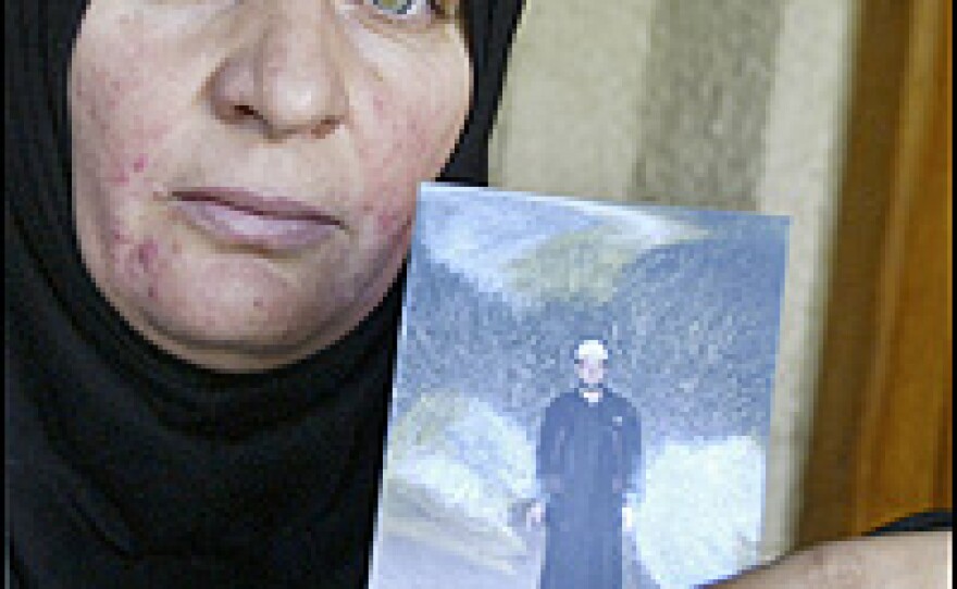 Maliya Abdul Hamid Hassan Ali holds a picture of her brother, Waleed, who died in the Haditha raid.