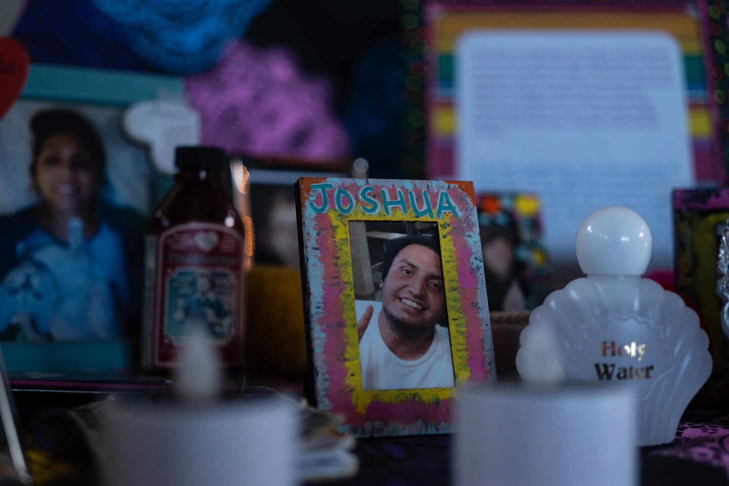 A photo a remembered loved one named Joshua is featured on an altar inside the Sherman Heights Community Center in San Diego on Oct. 17, 2023.