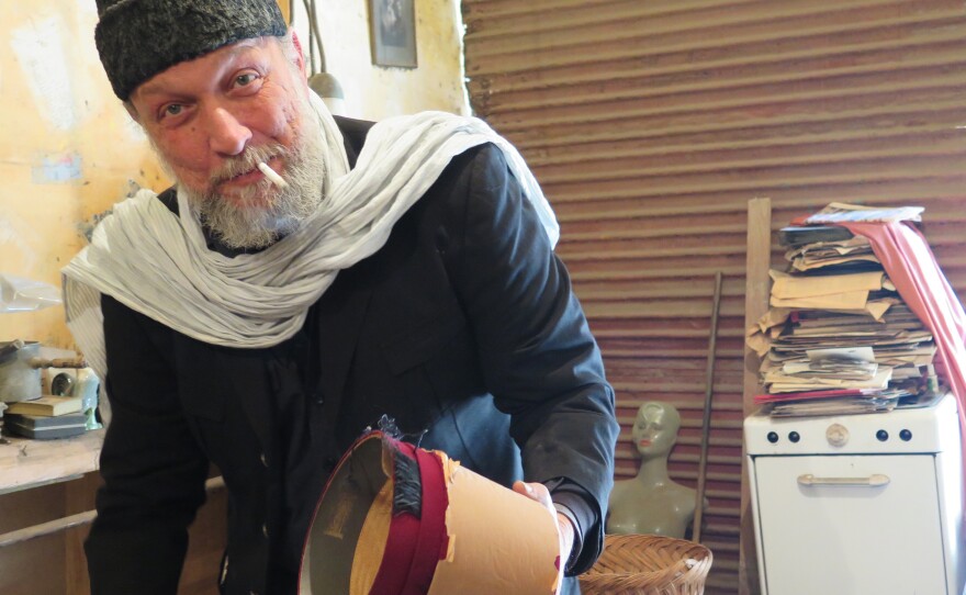 Amgad Naguib holds a fez â one of the first made in Egypt as part of a nationalist movement started in the 1930s to replace imported goods.