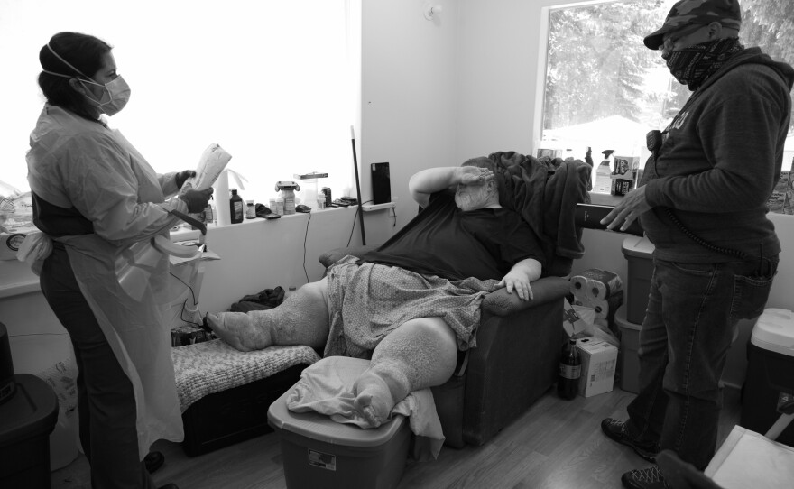 Sierra (left) and Richard West (right) meet with a patient at home on June 1, 2020. West is a mental health outreach counselor for Island County, which includes Whidbey and Camano islands. West's parents died from COVID-19 in 2020.