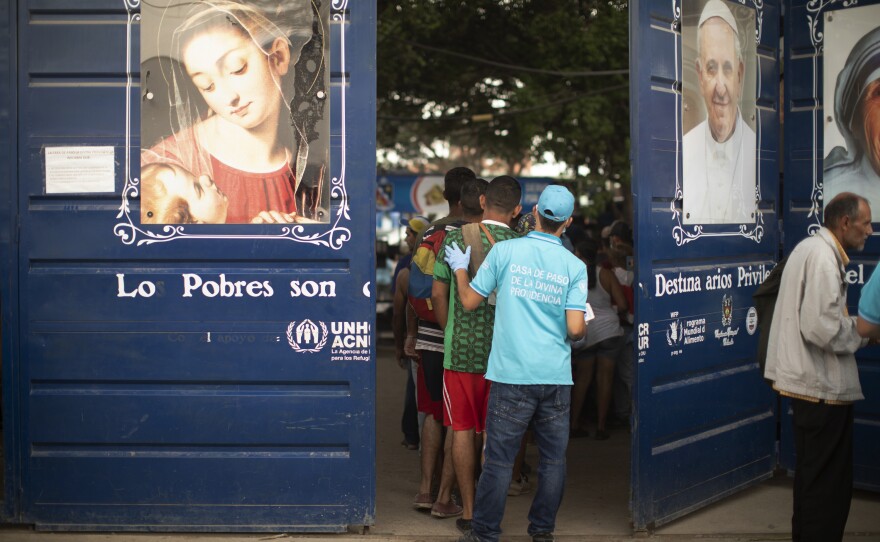 People file into Casa de Paso Divina Providencia, a Catholic charity kitchen that feeds thousands of Venezuelans in the Colombian border zone.