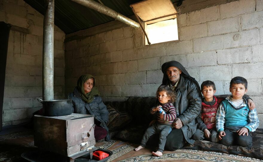 A Syrian family who lost their home during the deadly earthquake rest in a make-shift shelter at a camp for internally displaced people, in the Afrin region of Syria's rebel-held northern Aleppo province.