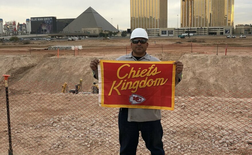 The photo from the fateful text showing Gerard DeCosta with the flag he said he buried under the field at Allegiant Stadium.