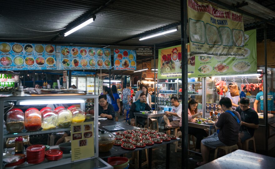 Dozens of hawkers sell dishes from all over the country at an outdoor food court in Jakarta, Indonesia.