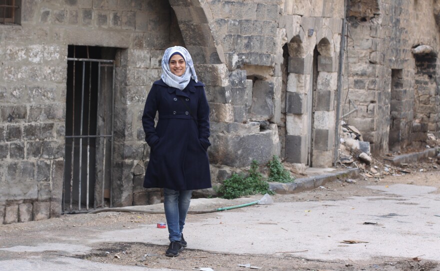 Architect Marwa al-Sabouni walks through the Old City of Homs in central Syria. It was one of the cities where the Syrian uprising began in 2011, and the opposition once controlled much of the city. But President Bashar Assad's forces have been back in control since 2014.