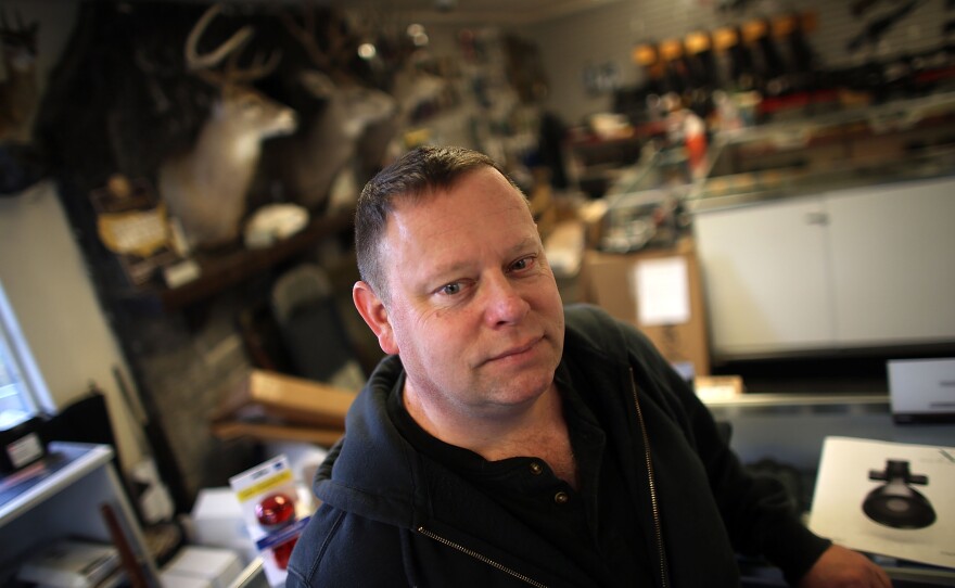 Erin Stoffel, 48, of Portland, Ore., visits Northwest Armory to check on a handgun he specially ordered  for his wife.