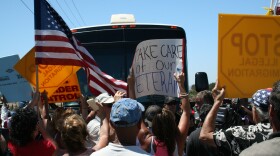 Protesters in Murrieta block the path of a charter bus containing migrants who entered the country illegally, July 1, 2014.