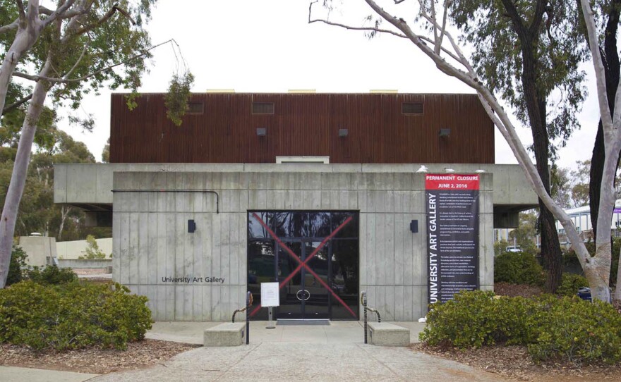 Collective Magpie, “Dispossessed: A call to PRAYER AND PROTEST,” intervention banner and red Exterior the University Art Gallery, UCSD.