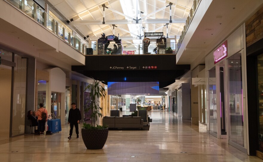 People walk around the inside of the North County Mall, Apr. 23, 2025.